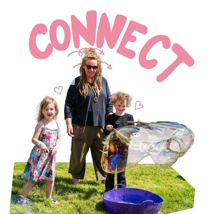 smiling chidren creating giant bubbles and the word connect