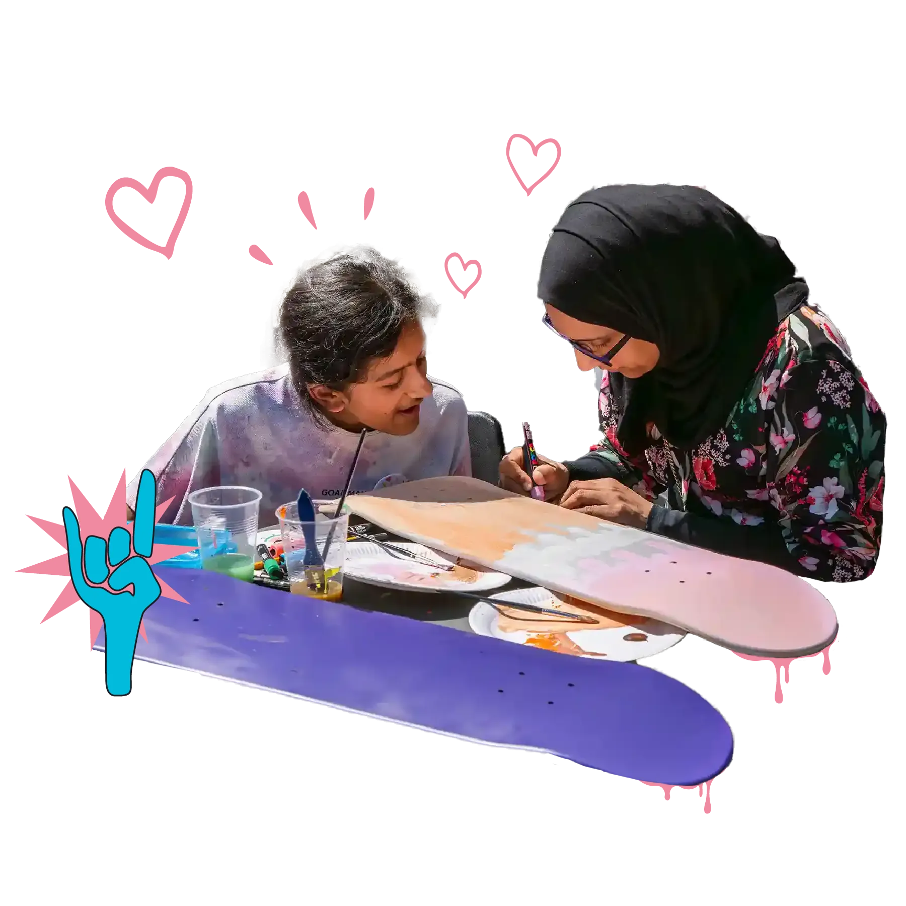 A woman and a daughter draw on a skateboard together with paint pens, text reads - creative workshops, take time to reflect with your family and friends