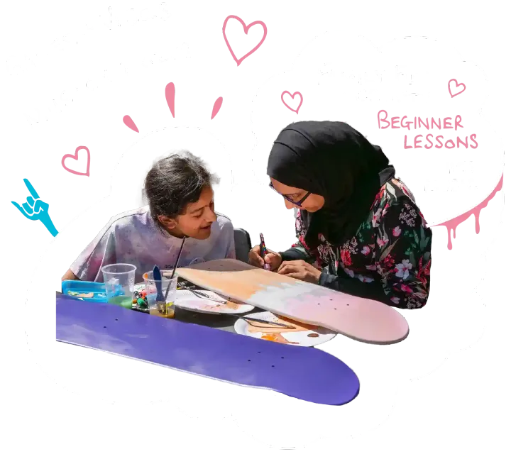 A woman and a daughter draw on a skateboard together with paint pens, text reads - creative workshops, take time to reflect with your family and friends